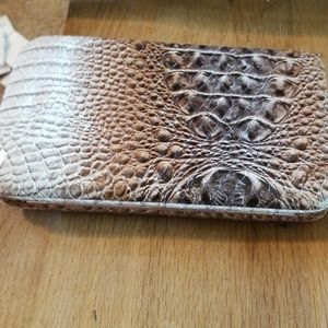 Snap leather wallet with alligator texture.